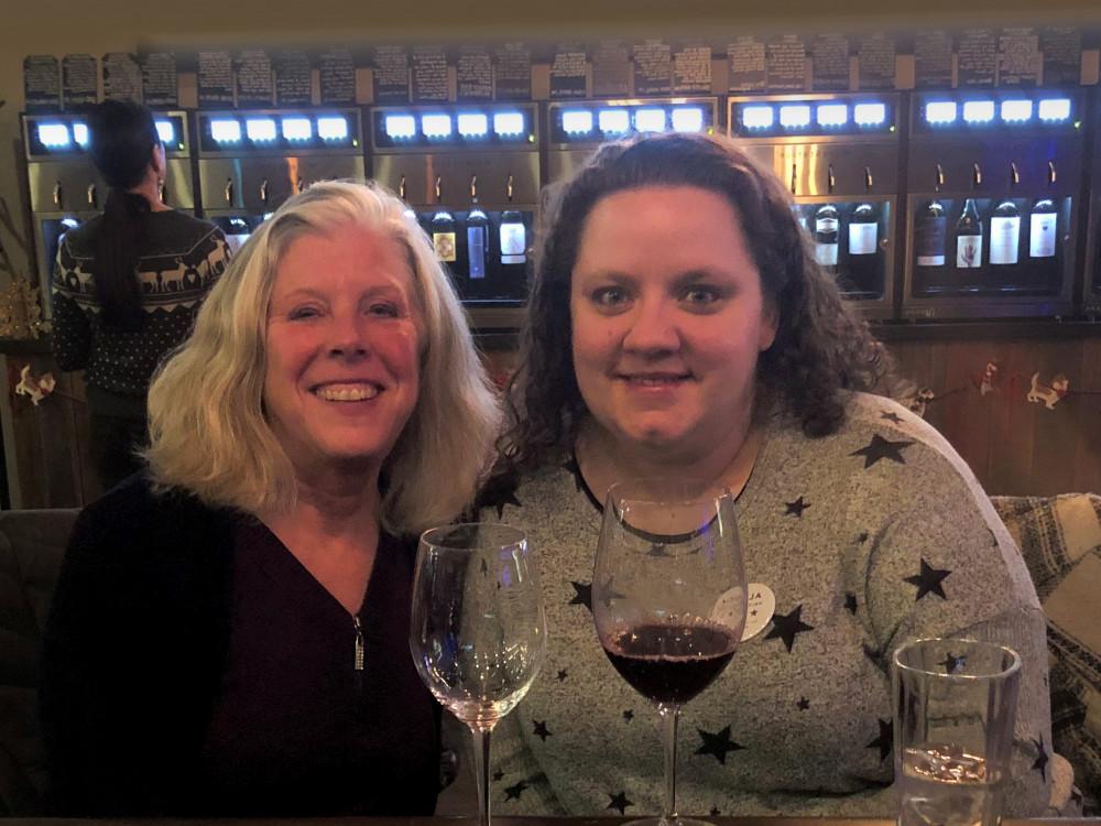 Enjoying good wine spans all generations. 而 Anne Wood Wandler'83, right, was meeting a new em...
